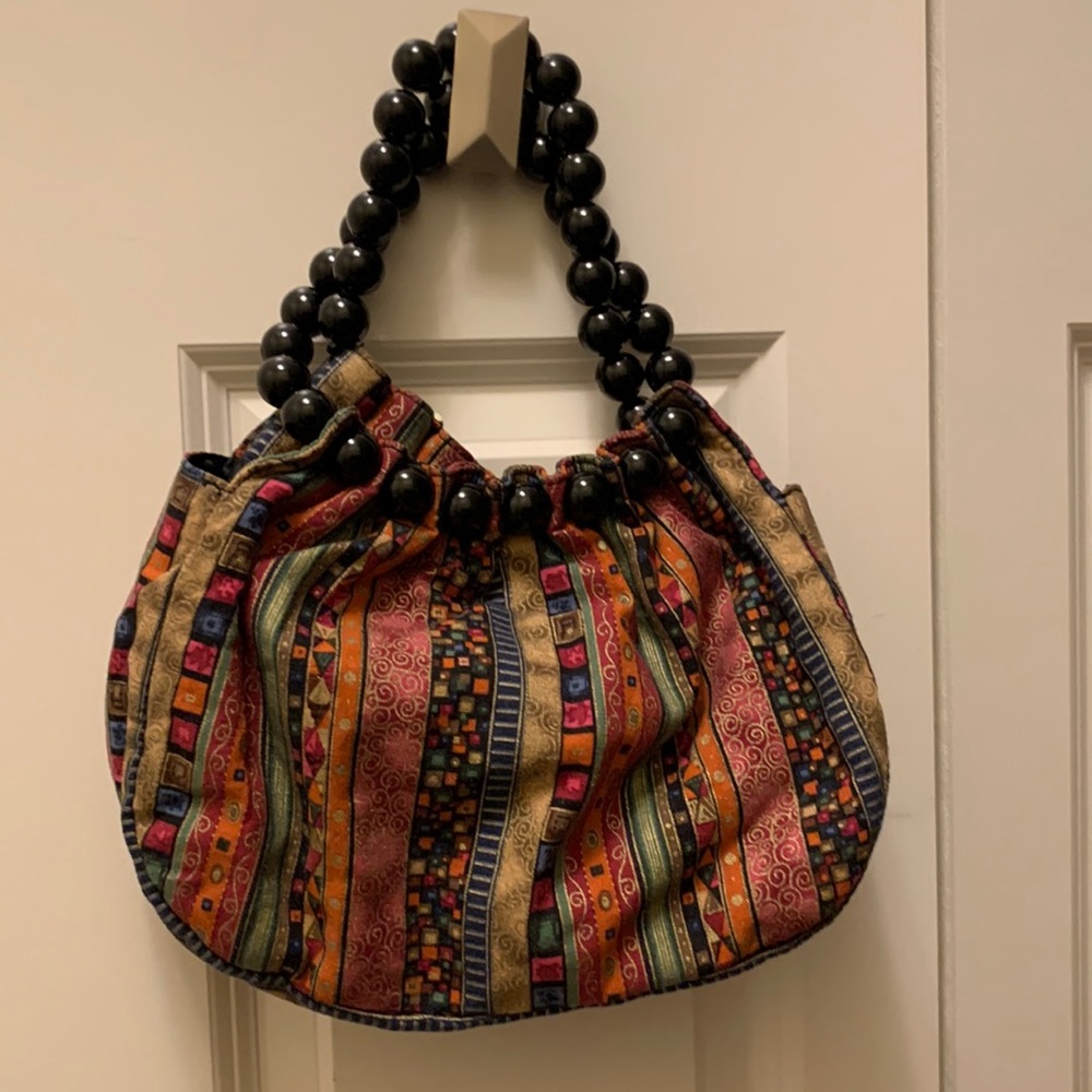 Small handbag by Indeed. Pocket on each side. “Like New”